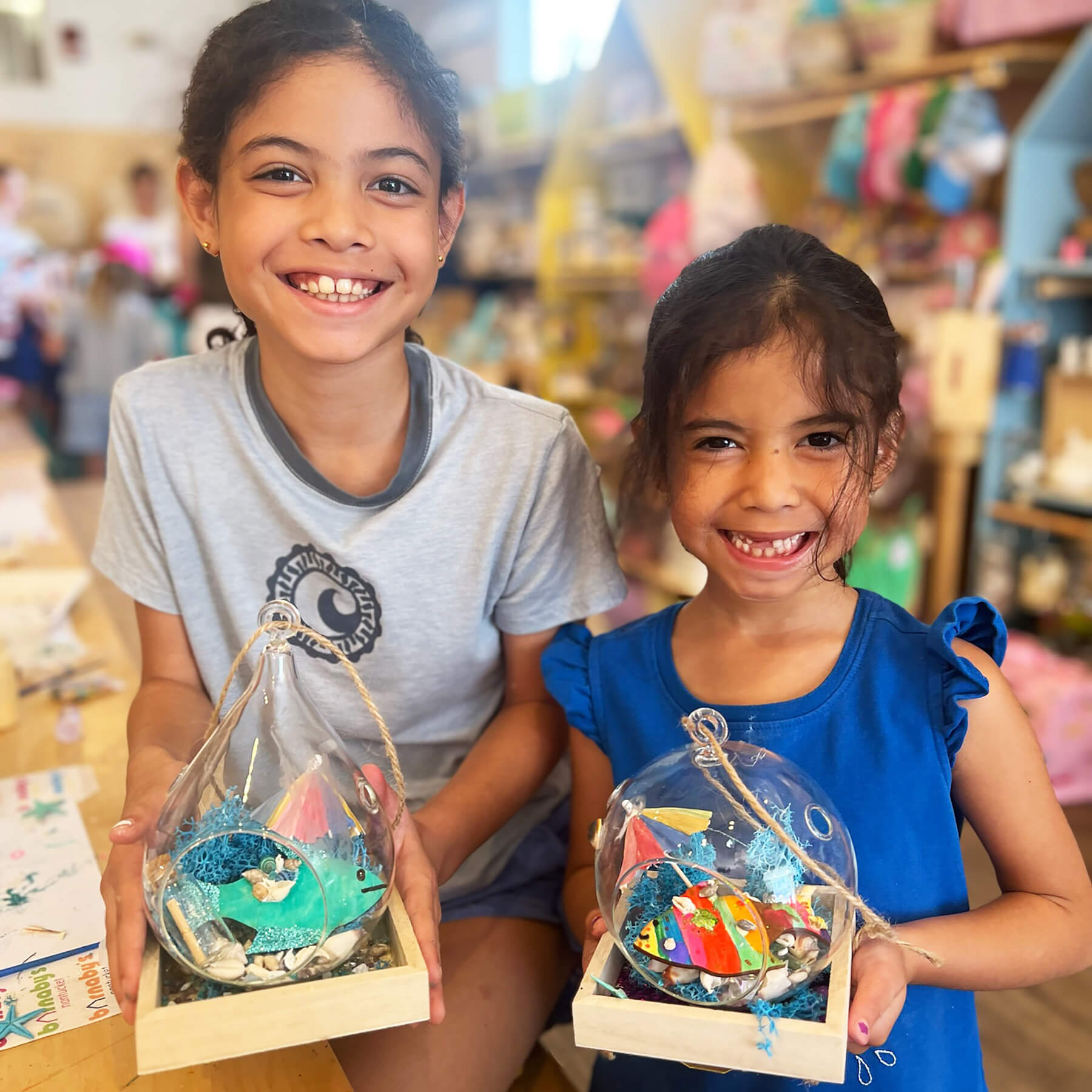 2 Kids in Barnaby's store after an art class