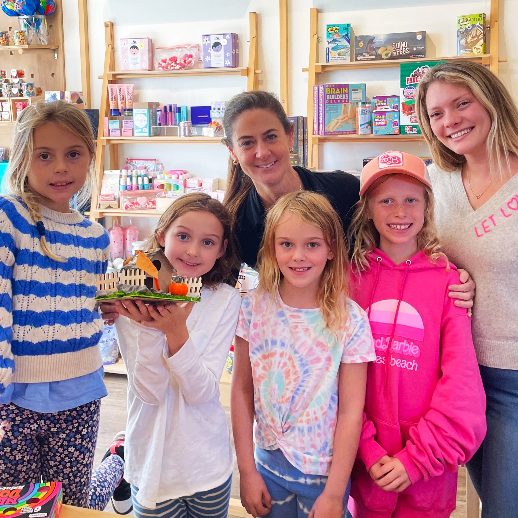 Wendy with group of kids after a class in the shop